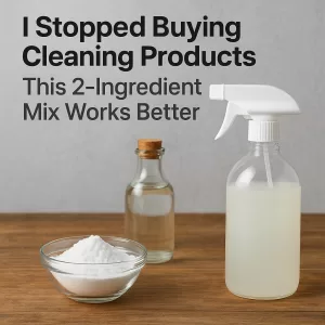 A glass bowl with white vinegar and a wooden spoon resting on a pile of baking soda, symbolizing a natural cleaning solution.